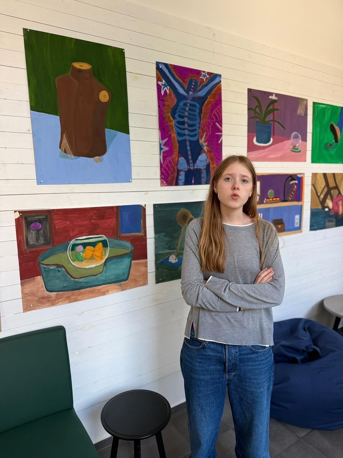 Laura Kolesnikovaitė standing in front of her exhibition